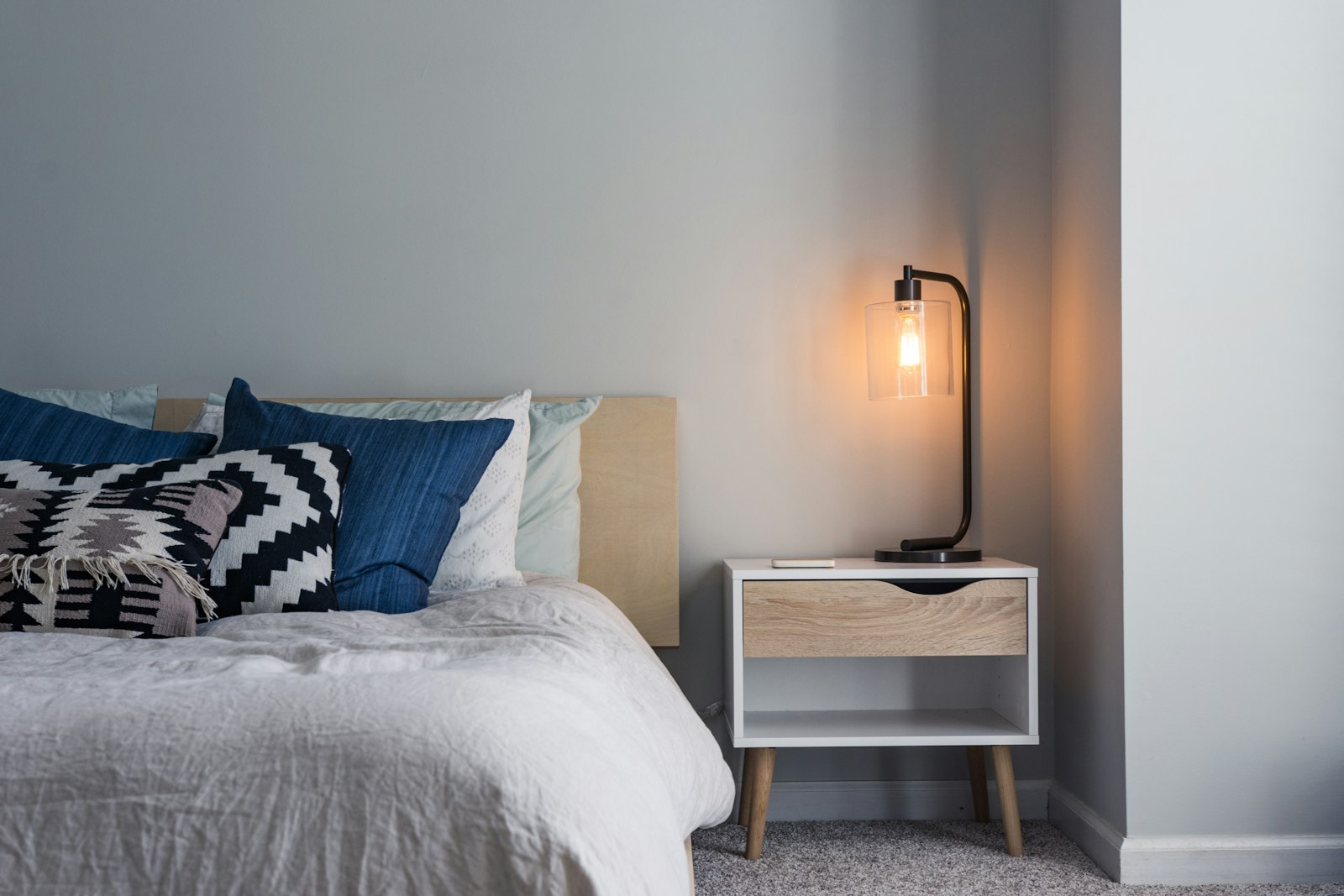 Comfortable bedroom with soft bedding and warm tones