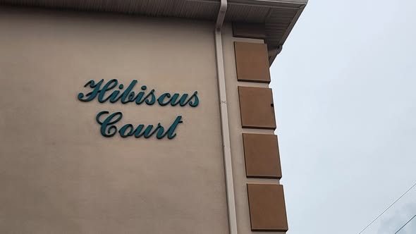 Hibiscus Court building sign