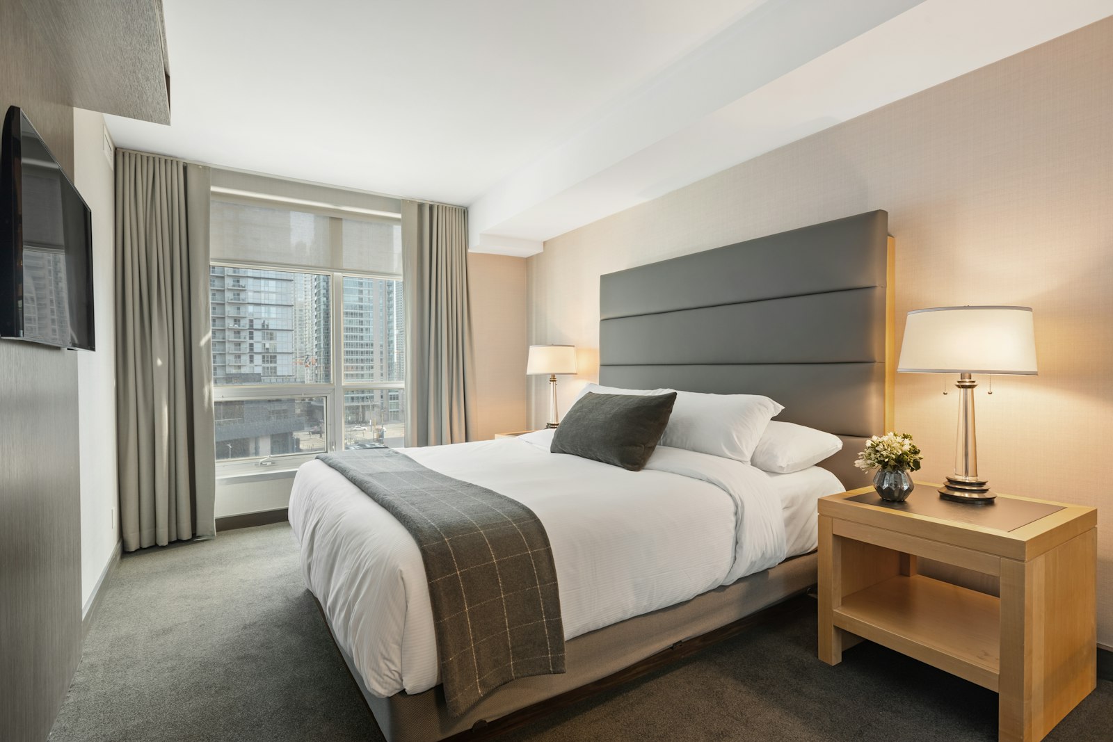 Peaceful bedroom suite with soft bedding and natural light